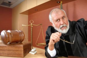Older judge thinking and making up his mind at trial